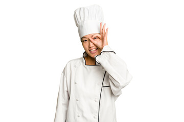 Young asian cook woman isolated excited keeping ok gesture on eye.