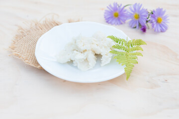 Shea butter on light background, unrefined, close up	