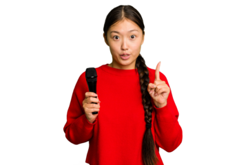 Young Chinese singer woman isolated having some great idea, concept of creativity.