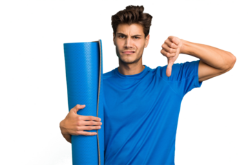 Young caucasian sport man holding a mat isolated showing a dislike gesture, thumbs down. Disagreement concept.