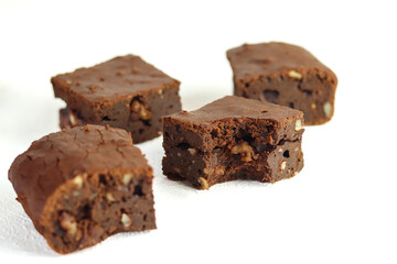 Pieces of fresh brownie isolated on a white background.