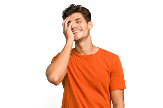 Young caucasian handsome man isolated laughing happy, carefree, natural emotion.