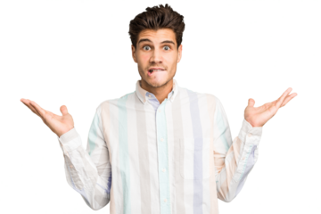 Young caucasian handsome man isolated confused and doubtful shrugging shoulders to hold a copy space.