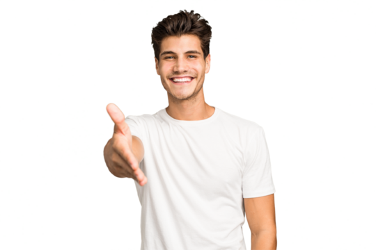 Young caucasian handsome man isolated stretching hand at camera in greeting gesture.