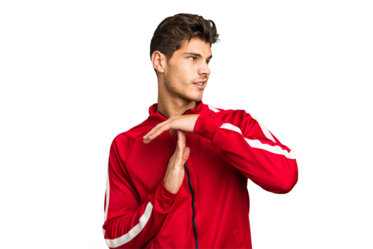 Young caucasian handsome man isolated showing a timeout gesture.