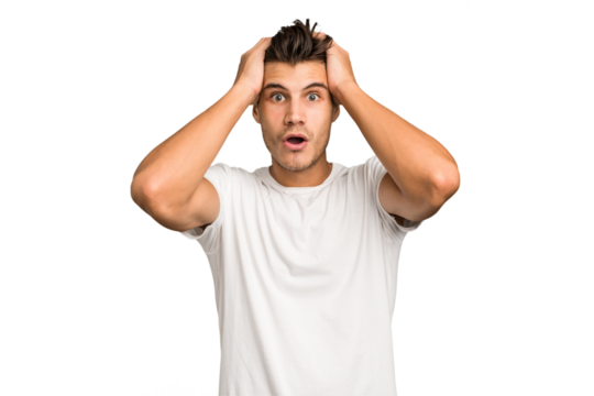 Young caucasian handsome man isolated being shocked, she has remembered important meeting.