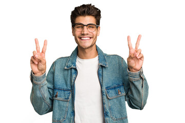 Young caucasian handsome man isolated showing victory sign and smiling broadly.