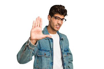 Young caucasian handsome man isolated rejecting someone showing a gesture of disgust.
