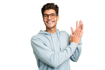 Young caucasian handsome man isolated feeling energetic and comfortable, rubbing hands confident.