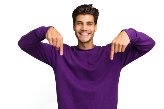 Young caucasian handsome man isolated points down with fingers, positive feeling.