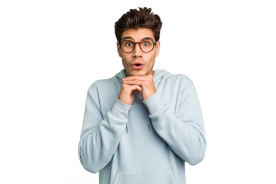 Young caucasian handsome man isolated praying for luck, amazed and opening mouth looking to front.