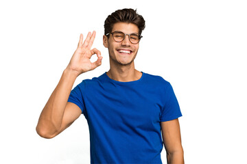 Young caucasian handsome man isolated cheerful and confident showing ok gesture.