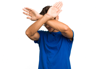 Young caucasian handsome man isolated keeping two arms crossed, denial concept.