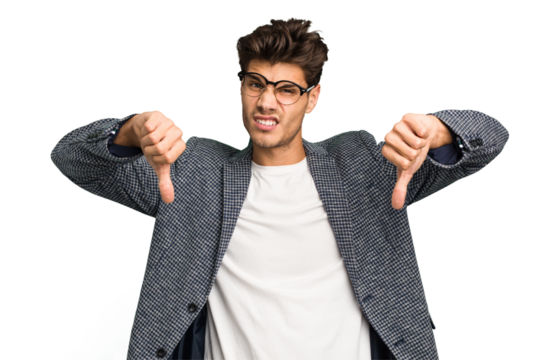 Young caucasian handsome man isolated showing thumb down, disappointment concept.