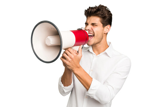 Young Caucasian Man Screaming With A Megaphone Isolated