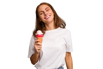 Young caucasian woman holding an ice cream isolated happy, smiling and cheerful.