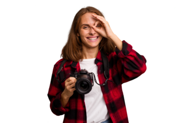 Young photographer caucasian woman isolated excited keeping ok gesture on eye.