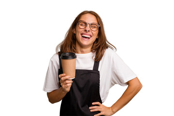 Young caucasian woman holding takeaway coffee isolated laughing and having fun.