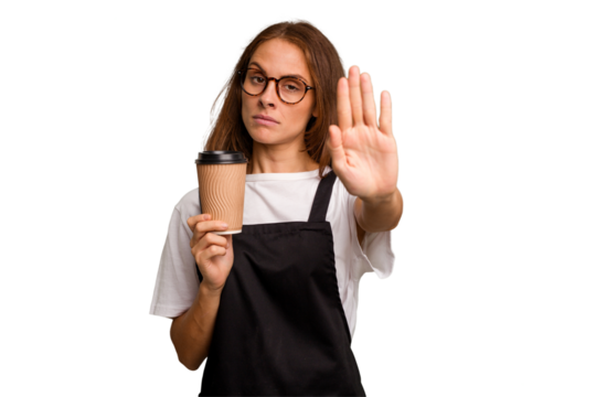 Young caucasian woman holding takeaway coffee isolated standing with outstretched hand showing stop sign, preventing you.