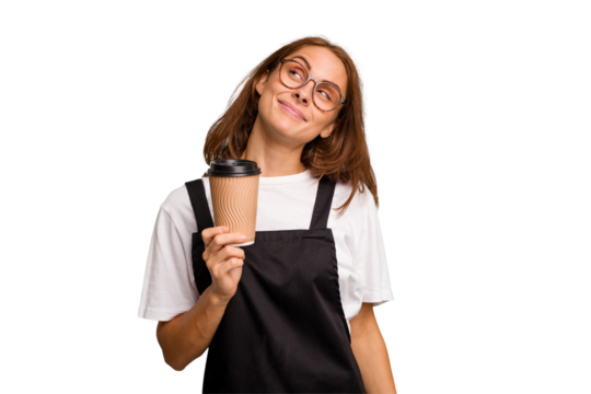 Young caucasian woman holding takeaway coffee isolated dreaming of achieving goals and purposes