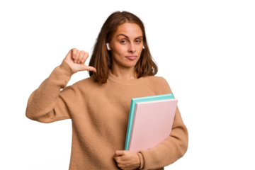 Young student woman holding a books isolated feels proud and self confident, example to follow.