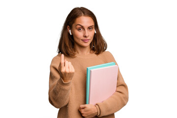 Fototapeta premium Young student woman holding a books isolated pointing with finger at you as if inviting come closer.