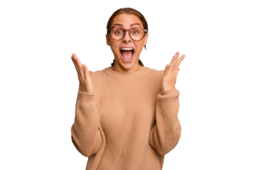 Young caucasian woman isolated celebrating a victory or success, he is surprised and shocked.