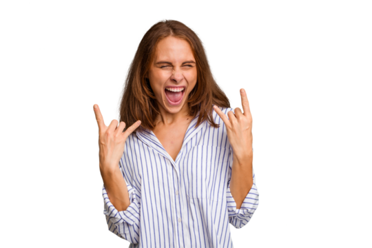 Young caucasian woman isolated showing a horns gesture as a revolution concept.