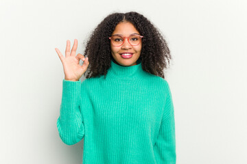 Young african american woman isolated on white background cheerful and confident showing ok gesture.