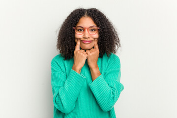 Young african american woman isolated on white background doubting between two options.