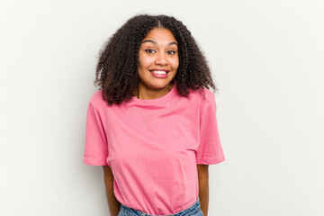 Young african american woman isolated on white background laughs and closes eyes, feels relaxed and happy.