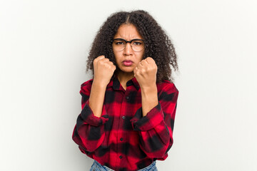 Young african american woman isolated on white background showing fist to camera, aggressive facial expression.