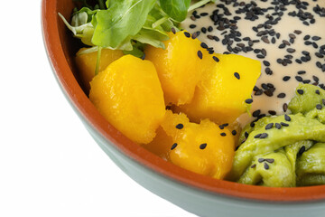 Fish poke bowl, with avocado, cucumbers, guacamole and red fish.