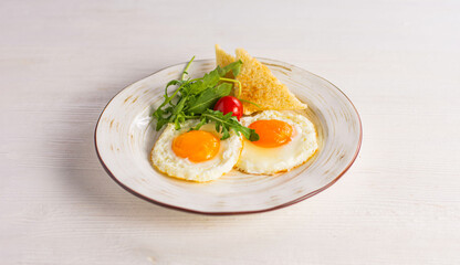 fried eggs with tomato and dill
