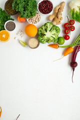 White cooking background with set fresh vegetables top view