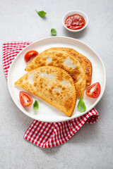 Meat pie cheburek top view on plate