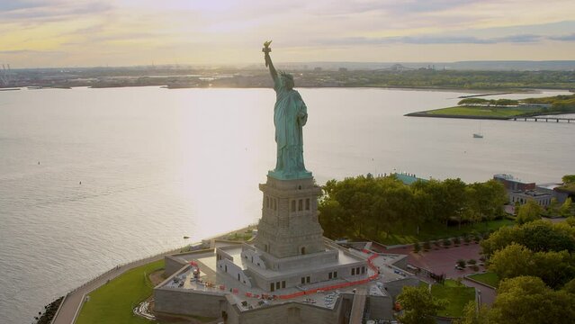 
Aerial Orbit of Statue of Liberty in Liberty Island, New York City. United States. This Magnificent Sculpture was designed by French sculptor Fr&eacute;d&eacute;ric Auguste Bartholdi. Backlit. Shot from Helicopter