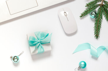 Christmas or New Year concept business flat lay with gift box,  festive decorations and keyboard on the white background. Top view