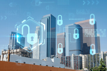 Panorama cityscape of Los Angeles downtown at day time, California, USA. Skyscrapers of LA city. Glowing Padlock hologram. The concept of cyber security to protect companies confidential information
