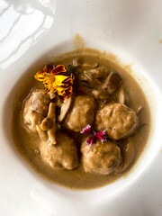 Plate with meatballs in sauce