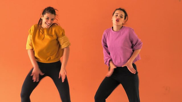 modern dance students rehearse a synchronized dance technique