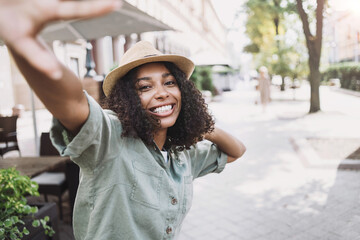 Young beautiful woman portrait, Happy african american student girl smiling in a city, People enjoy...