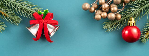 Christmas background design concept with beautiful decors, tree branch and golden bell.