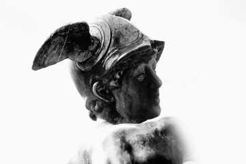 Black and wwhite image of ancient statue of the antique god of commerce, merchants and travelers...
