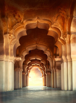 Arch of Lotus Mahal Temple in Hampi, Karnataka, India. Unesco world heritage site.beautifully carved stone arch and sunset