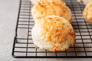 Coconut macaroons, small cake or biscuit, cookies. On a cooking tray.