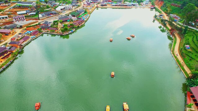Drone is flying over a Chinese village in Thailand, &ldquo;Ban Rak Thai&rdquo; Lake early morning. Famous tourist attractions in Thailand. aerial view. Mae Hong Son, Northern Thailand. Southeast asia. 4K
