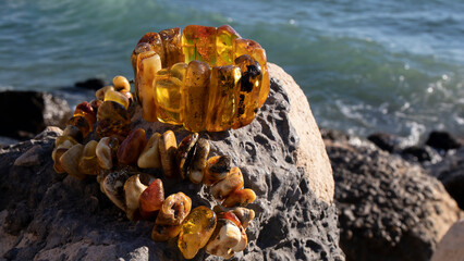 Old transparent yellow Baltic amber bracelet with plant inclusion and multicolored amber necklace ...