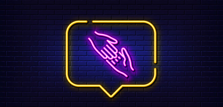 Neon light speech bubble. Helping hand line icon. Give gesture sign. Charity palm symbol. Neon light background. Helping hand glow line. Brick wall banner. Vector