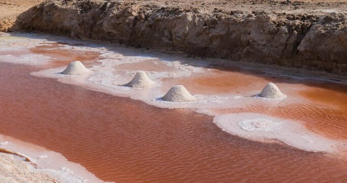 Salt lake in Tunisia Chott el Djerid red color of water from the salt minerals. Largest salt lake in the Sahara Desert. Tourist destination. Travel the world.